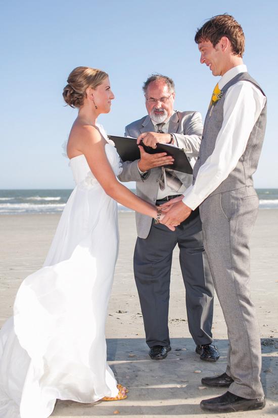BLOWING IN THE WIND: Sara and Josh said “I do” with the idyllic Folly Beach for a backdrop. Sara’s grandfather, who was a minster, delivered a very special blessing to the couple during the ceremony.