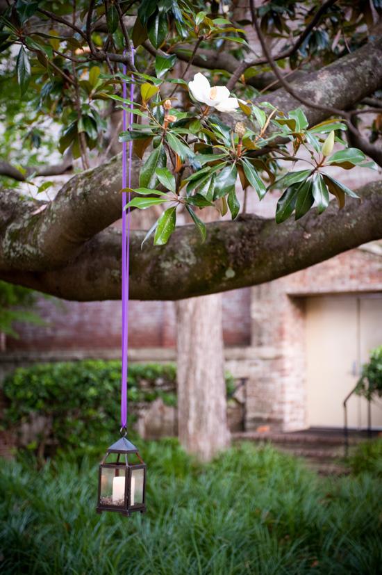 HANGING AROUND: After the sun had set, lanterns—tied with signature purple ribbon—helped light the backyard of the William Aiken House.