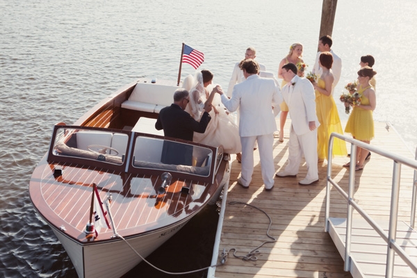 DOCKSIDE DELIGHT: Lindsey’s journey to the altar was nothing short of adventurous, gracefully exiting the boat with the help of groomsmen.