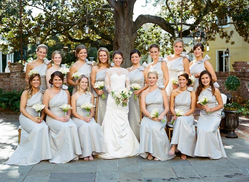 Bridal attire by Monique Lhuillier, available in Charleston through Maddison Row. Bridesmaid attire by Amsale from Bella Bridesmaids. Bouquets by Sara York Grimshaw Designs. Image by Marni Rothschild Pictures.