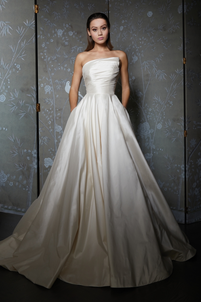 ONE OF A KIND - Romona Keveza “Legends L2054” Why We Love It “The asymmetrical draped neckline on this ball gown is so cool and different.”   –Michelle Miller, Maddison Row South