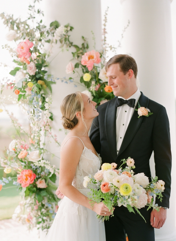 With its dainty lace floral motif, Beccar’s “Gardenia” gown was the perfect fit for the flower-powered wedding.