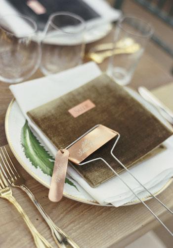 Luxe Appointment: “We wanted an old-school restaurant feel for the menu book,” says Tara of the handcrafted velvet menus. Copper butler cards were engraved with guests’ names.