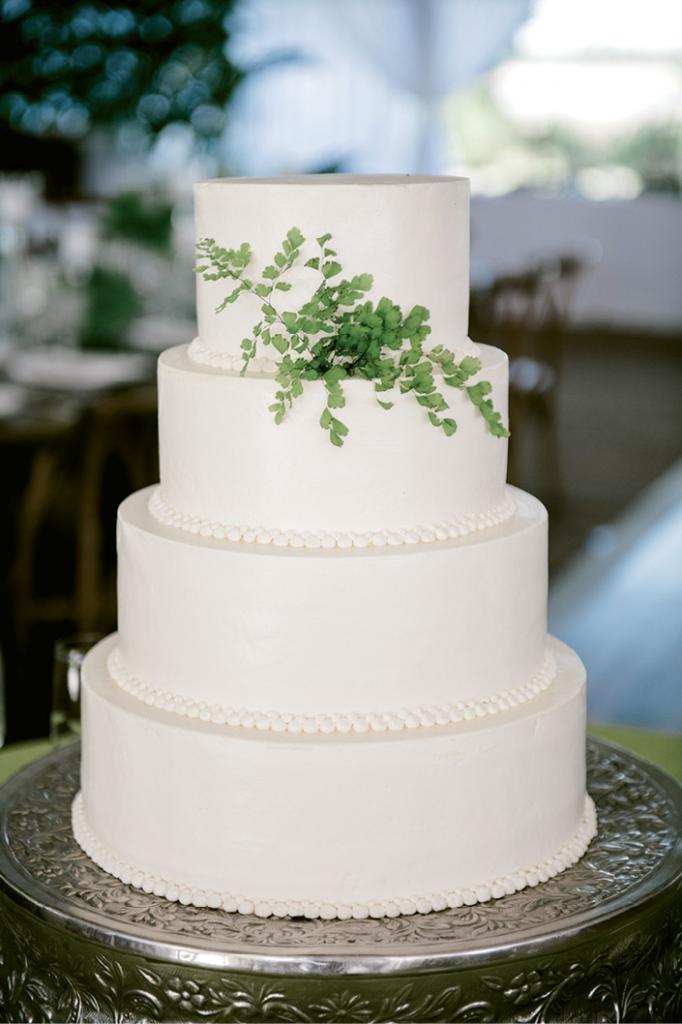 In the same vein as the bride’s clean-lined, classic white column wedding gown, their wedding cake was the epitome of understated elegance.