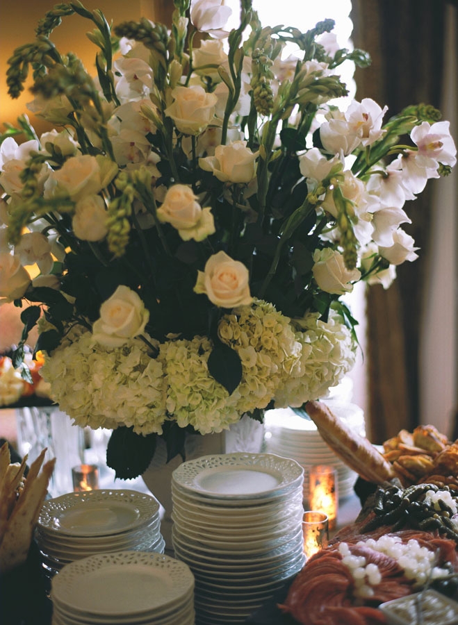 FEAST FOR THE AGES: Sara says she and Dominick wanted the reception to convey an “old world,” traditional feel, which a charcuterie spread and grand florals helped to create.