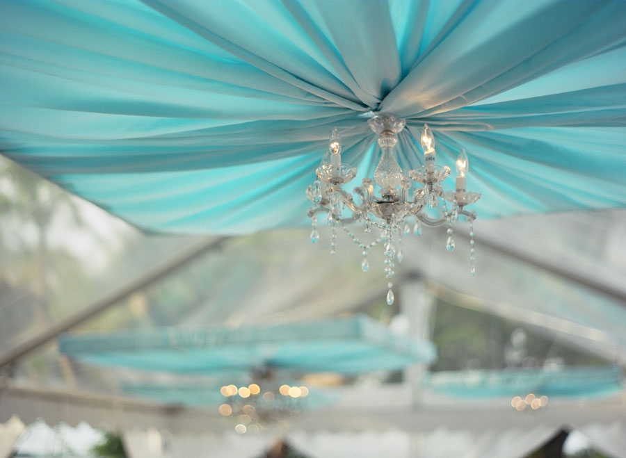 CRYSTAL CLEAR: Chandeliers gave a shimmering finish to the dinner tent top’s panels of ruched chiffon.