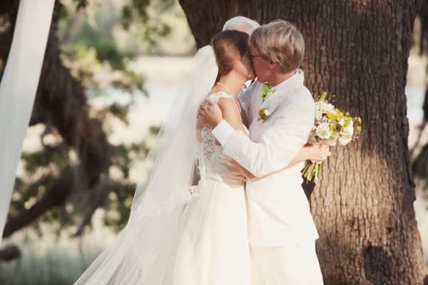SEALED WITH A KISS: The couple sealed their “I do’s” with a kiss in front of the ancient oak tree.