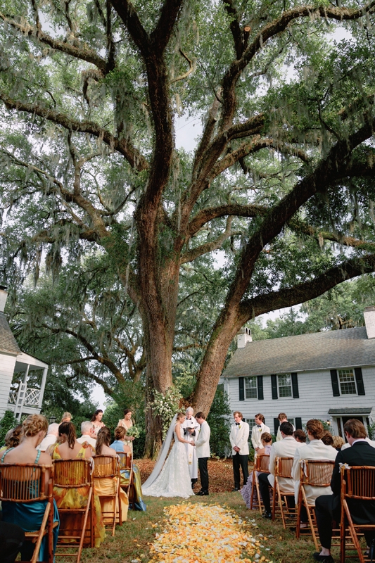 The outdoor ceremony was held in the courtyard before a grand live oak in front of 230 guests.
