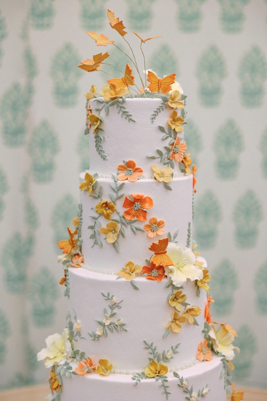 A five-layer wedding cake from Jim Smeal doubled as edible art.