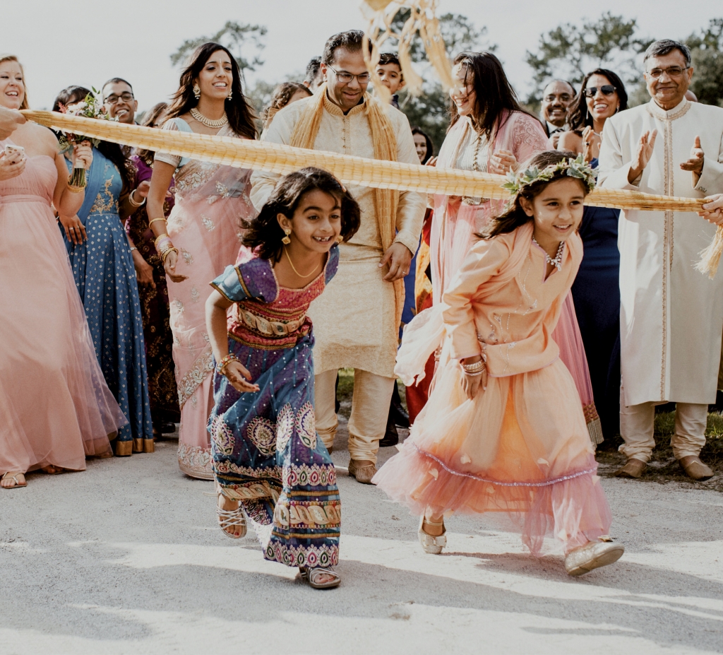 “The baraat is a huge party before the ceremony,” says bride Jennifer Deitz who exchanged vows with Agam Jain at Middleton Place in an Indian fusion wedding. “Everyone gets pumped and excited.”