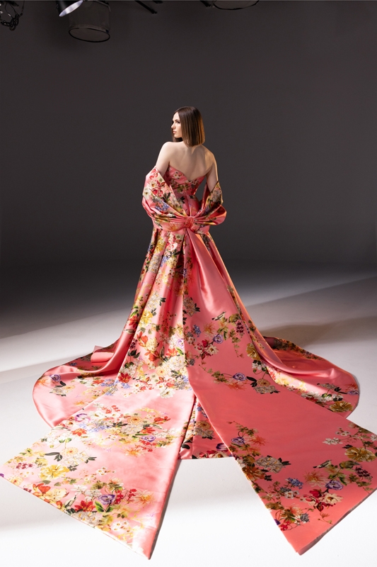 Romona Keveža silk ball gown with sculpted sweetheart neckline, cathedral tails, and bow stole in “pink chinoiserie,” $6,589 (gown) &amp; $2,490 (stole) at Maddison Row South.