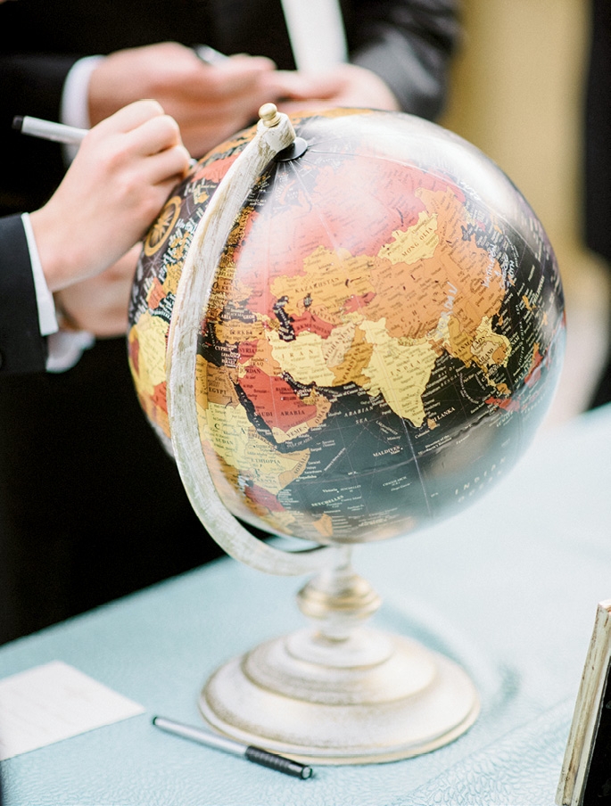 Guests signed a small  globe the couple now  keeps at home for  a sentimental  decoration. (Photograph by Sean Money + Elizabeth Fay)