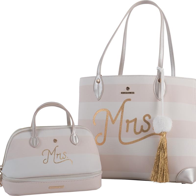 The “Soon-to-be Mrs.” tote ($98) and the “Mrs. Pretty” prep bag ($68)  in white and ivory vinyl with embellished bag tags and tassels, both from Spartina 449