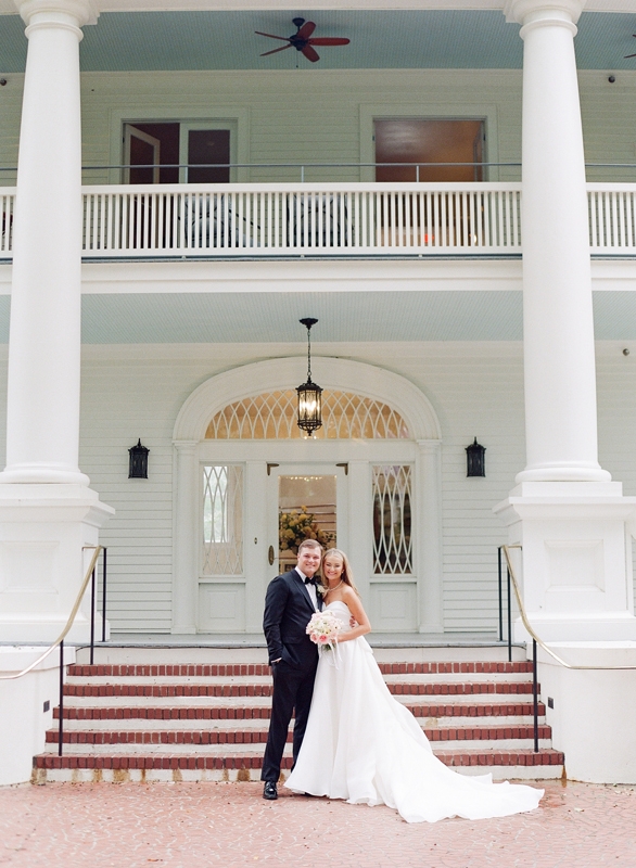 On October 14, 2023, Cate Marr and Alex Rock wed on the grounds of North Charleston’s Venues at Riverfront Park, home to the Admiral’s House, a 1905 neoclassical manse. The grounds and several historic buildings hosted 280 guests, but Cate’s thoughtful planning ensured the setting felt cozy and intimate.