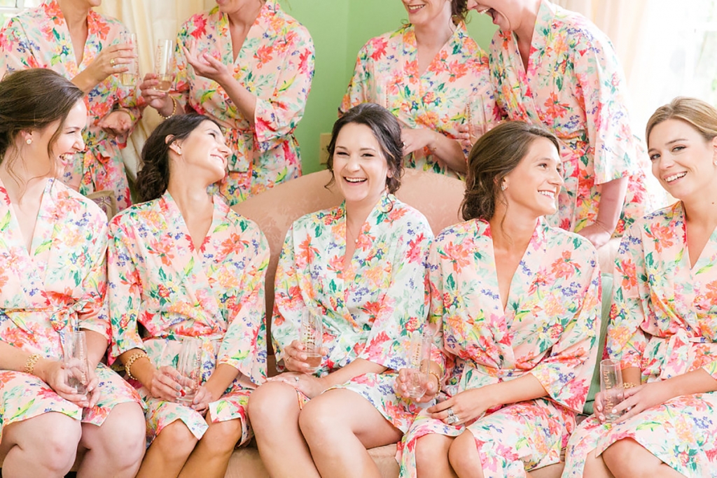 Made of breezy cotton, the bridesmaids’ robes—a gift from the bride—were as practical as they were pretty on the sultry wedding day. In a triumph of kismet coordination, they also matched bold floral tablecloths that stole the show during cocktail hour. “My mom and I found the linens first, so perhaps subconsciously I was thinking about them while searching for robes,” says Andra.