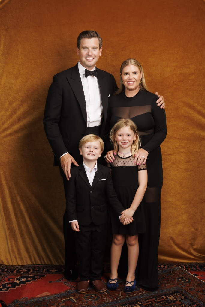 Ever the planner, Kelly knew to color-coordinate the family (and asked guests to dress in black as well).