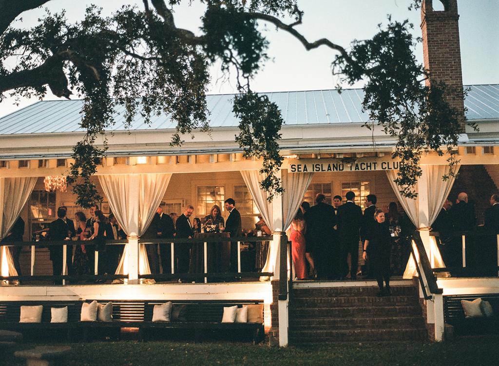 A full moon cast a soft, soothing glow on the porch of the club, where the bride has spent many weekends, shucking oysters and gazing at the boats that pile in for the annual Rockville Regatta.