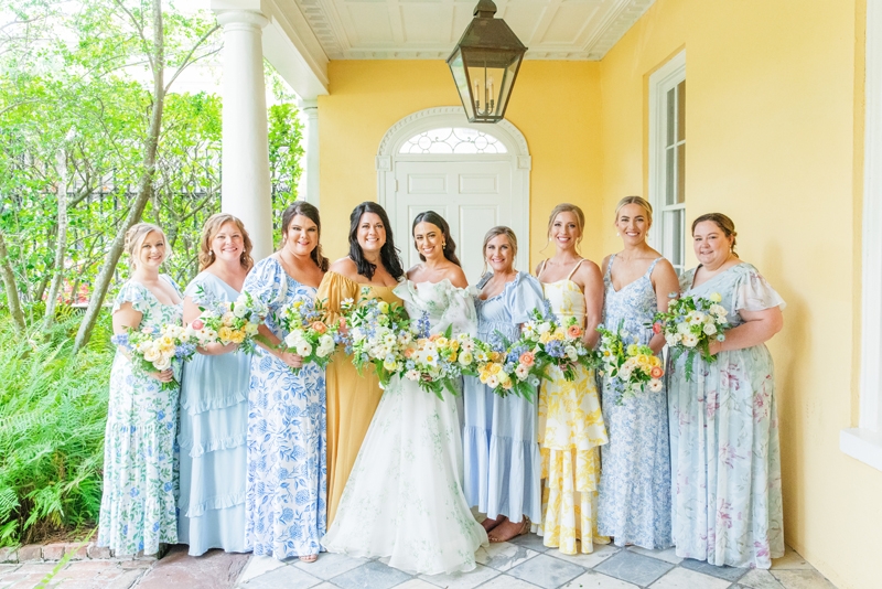 Bouquets by Festoon pulled together the blue and yellow dresses worn by the bridal party.