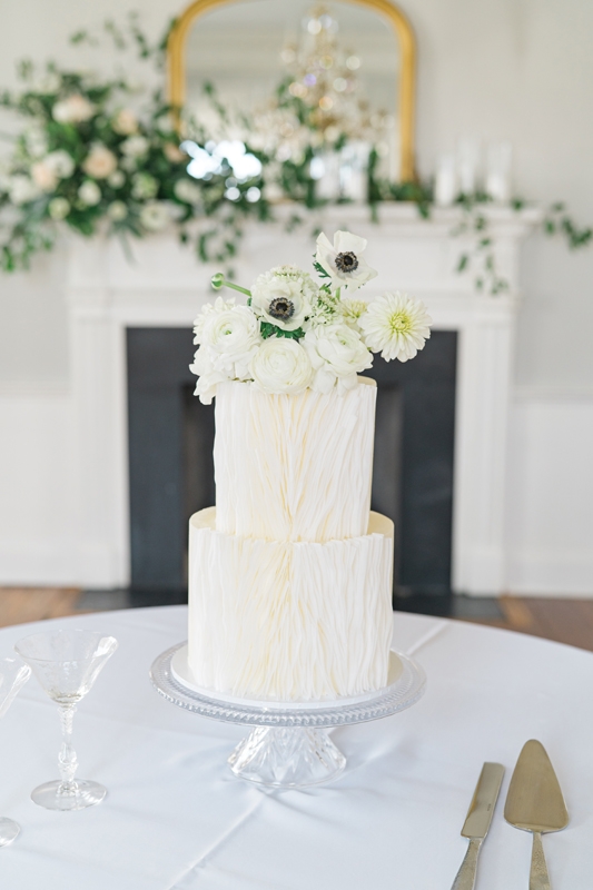 Cake Couture - For this sweet stunner, Taryn DeYarman of Flowerchild used wafer paper (also known as rice paper) to create a modern yet organic texture that enveloped the sides of each tier. In lieu of a topper, a quaint collection of fresh florals adorn the top layer.