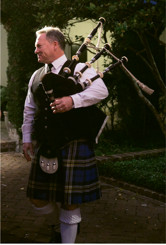A bagpiper played throughout the ceremony and as the couple walked into their reception.