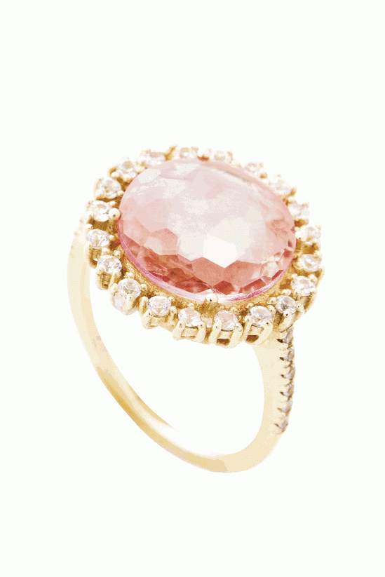 PRETTY IN PINK:  14K yellow gold ring with a salmon topaz center and halo and band inset with white sapphires (.50 total cts.) Croghan’s Jewel  Box, $1,380
