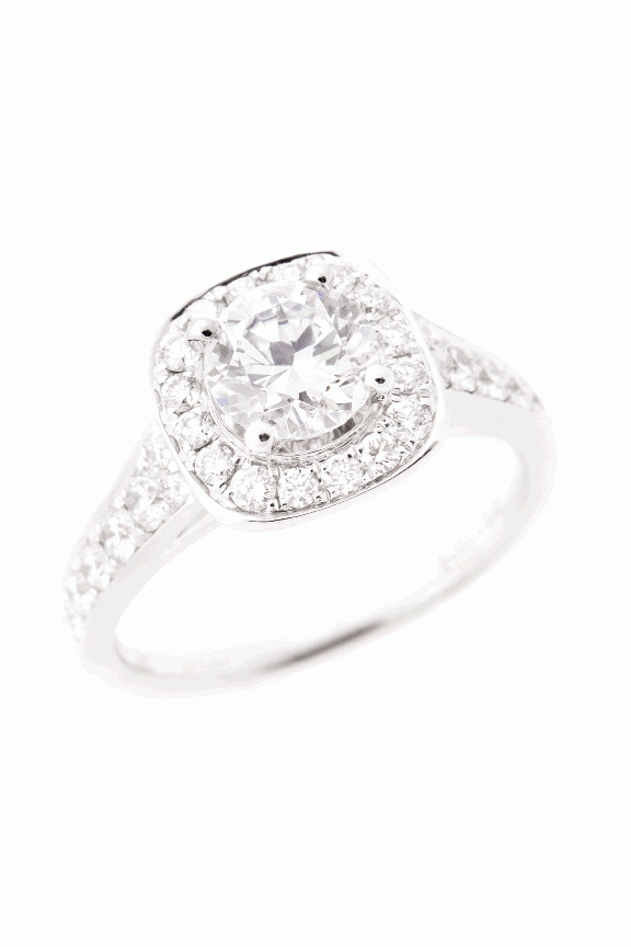 ICE PRINCESS:  Scott Kay’s 14K white gold ring with a halo of round-cut diamonds and band inset with pavé diamonds (.625 total cts.) REEDS Jewelers, $3,270, setting only