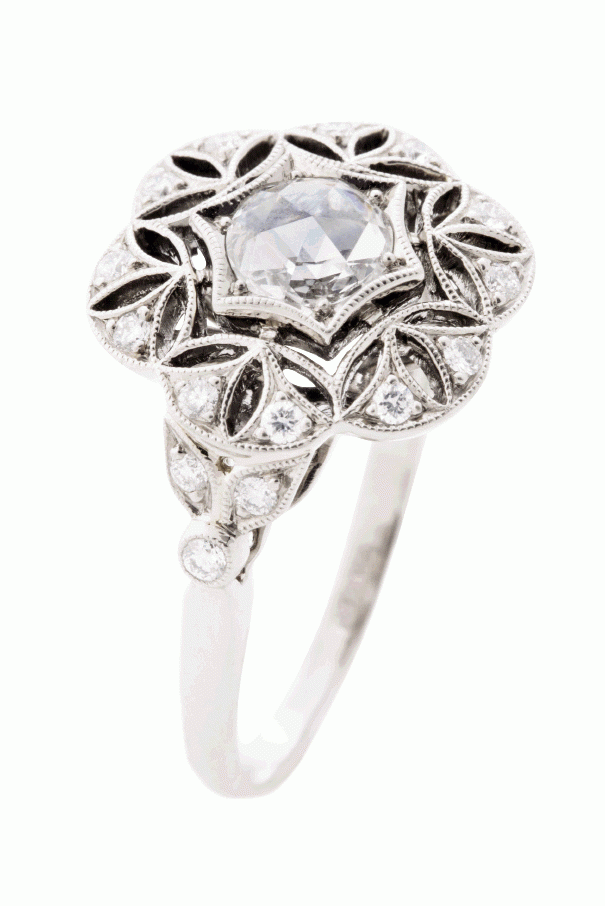 FLOWER POWER:  Kwiat’s 18K white gold ring with a rose-cut  center diamond and  accent diamonds  Paulo Geiss Jewelers, price upon request