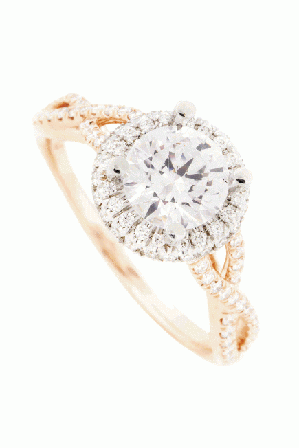 TWIST &amp; SHOUT: 14K rose gold ring with a halo of pavé diamonds set in white gold on a twisted shank inset with pavé diamonds (.30 total cts.) Skatell’s Manufacturing Jewelers, $2,850, setting only