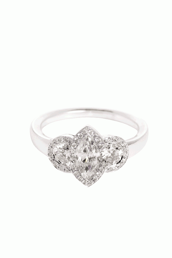 Three Times the Charm: : Hans D. Krieger’s 18K white gold ring with marquise-cut diamond flanked by two round diamonds.