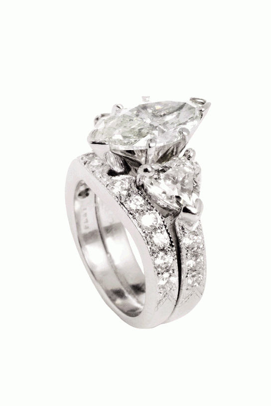 HEART OF THE MATTER: Platinum ring with 2.52 ct. marquise-cut diamond flanked by heart-shaped diamonds (1.54 total cts.) and accented with round diamonds (.72 total cts.) Joint Venture Estate Jewelers, $24,000