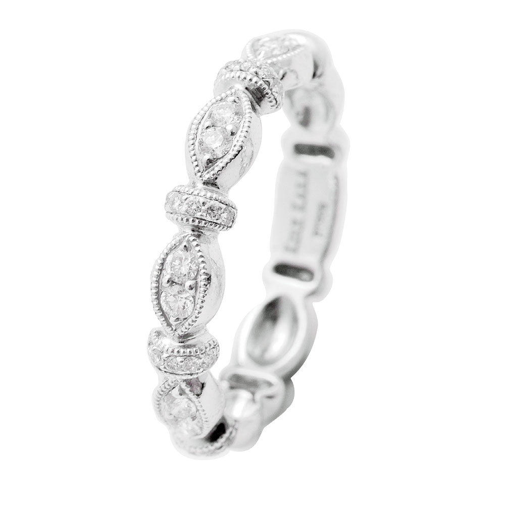 Dahlia Collection by Kirk Kara’s platinum ring with accent diamonds (.23 total cts.; setting only) and matching band with diamonds (.26 total cts.), both from Diamonds Direct (prices upon request)