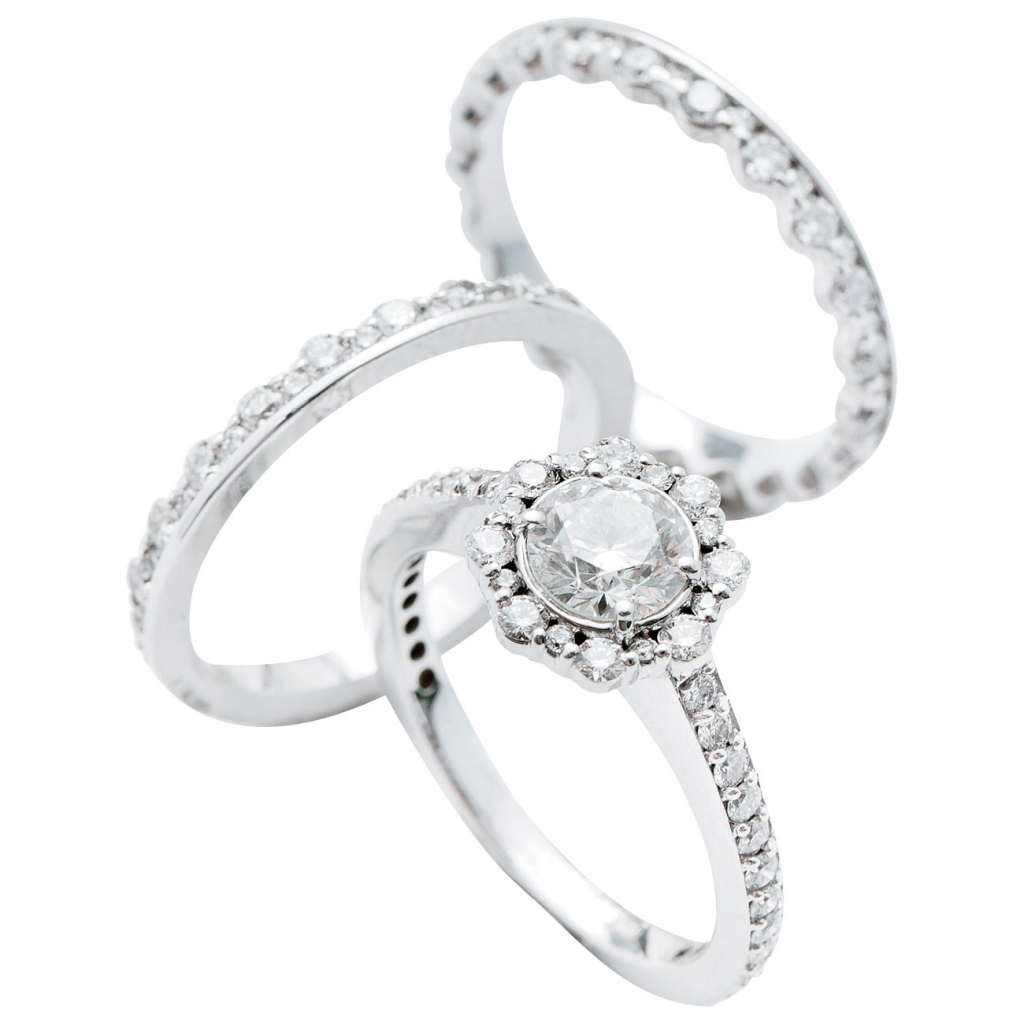 Forevermark Integré by  Pluczenik’s 18K white gold bands with diamonds (1.3 total cts. each, $3,600 for pair) and ring with diamond center (.7 cts.) and accent diamonds (1.3 total cts., $5,720), all from Paulo Geiss Jewelers