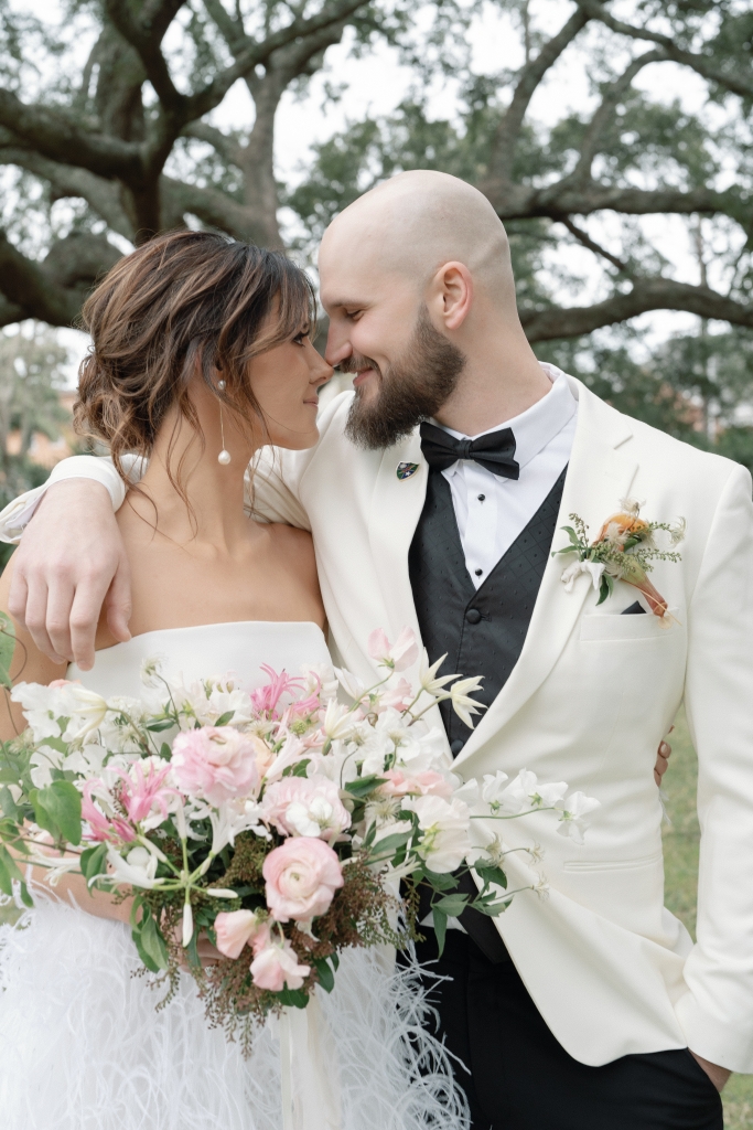 Pink, green, and white were the colors of the day. The feathery detail carried through in the bride’s Monique Lhuillier wedding gown.