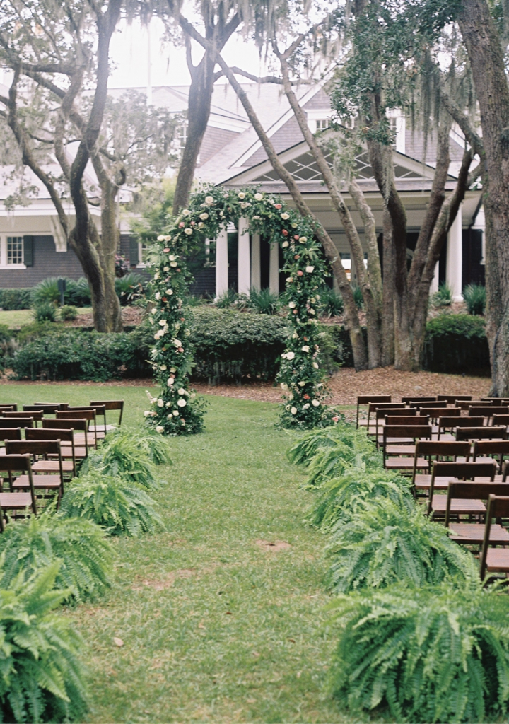 Coastal decor and lush greenery suited the Lowcountry landscape, while jasmine vines woven into the chandelier and around the cake stand represented Jazmine and Will’s favorite time in Charleston: when the vine’s blooms perfume the air each May.