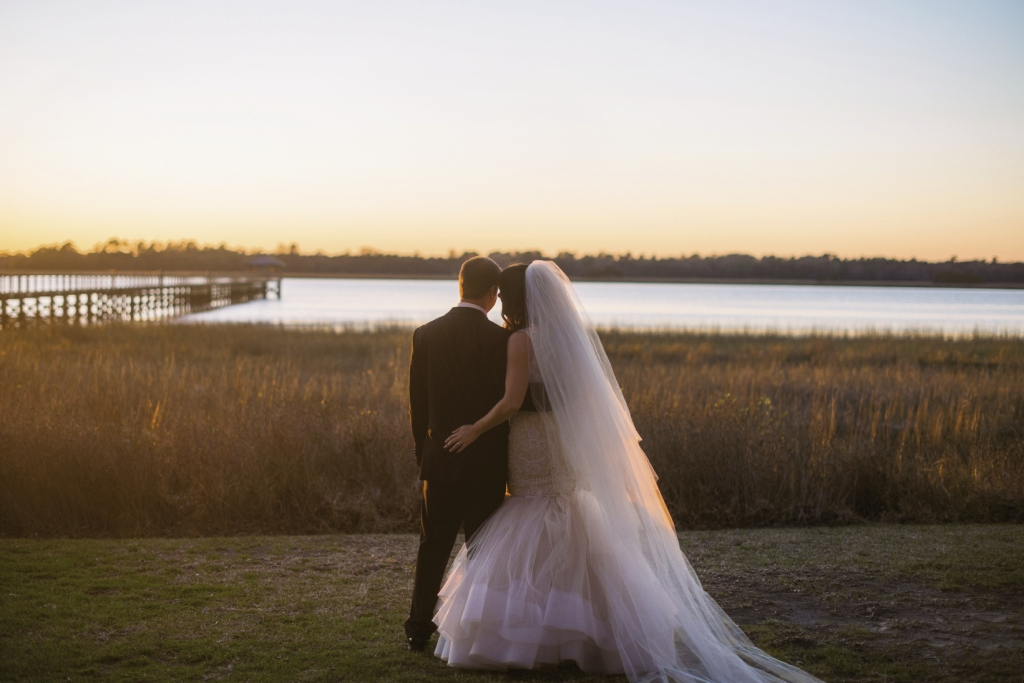Bride&#039;s gown by Lazaro (available locally at Gown Boutique of Charleston). Image by Timwill Photography at Lowndes Grove Plantation.