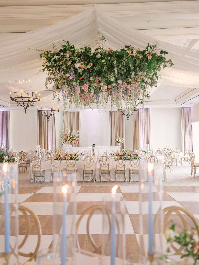 Pixie Clauson and Evan Forrest’s June 17 wedding at Daniel Island Club was a botanical summer dream. While the venue’s ballroom can seat some 300, Yoj Events mindfully designed a floor plan better suited for their guest list of 150, with the dance floor at its center.