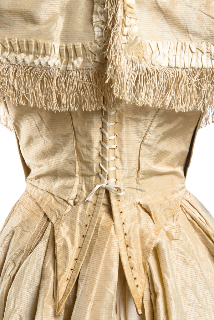 Louisa Jane Dearing, 1859. Close-up of her wedding gown from the back and its lace up corset bodice