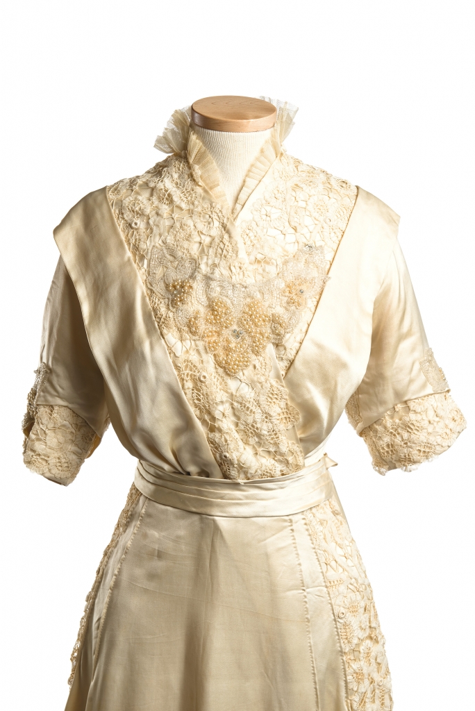 Wilhelmina Dorothea Meyer, 1914: While simple, unstructured silhouettes were all the rage at the start of the 20th century, the clusters of pearls, glass beading, lace and tulle trim, and watteau train of bride Wilhelmina Dorothea Meyer’s silk gown added special-occasion sophistication in spades. Wilhelmina wed Adolph Gevert Hollings on January 7, 1914, in the Holy City.
