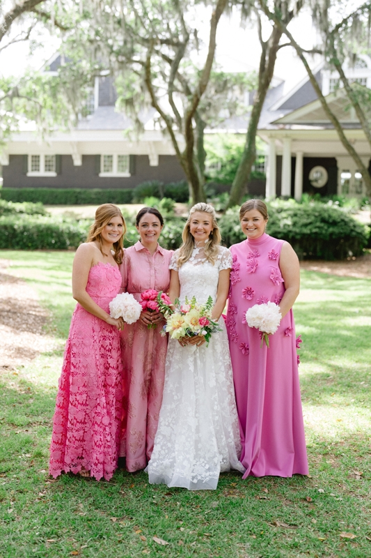 Each bridesmaid chose her own dress in a cheerful shade of pink and carried pink-hued peonies.