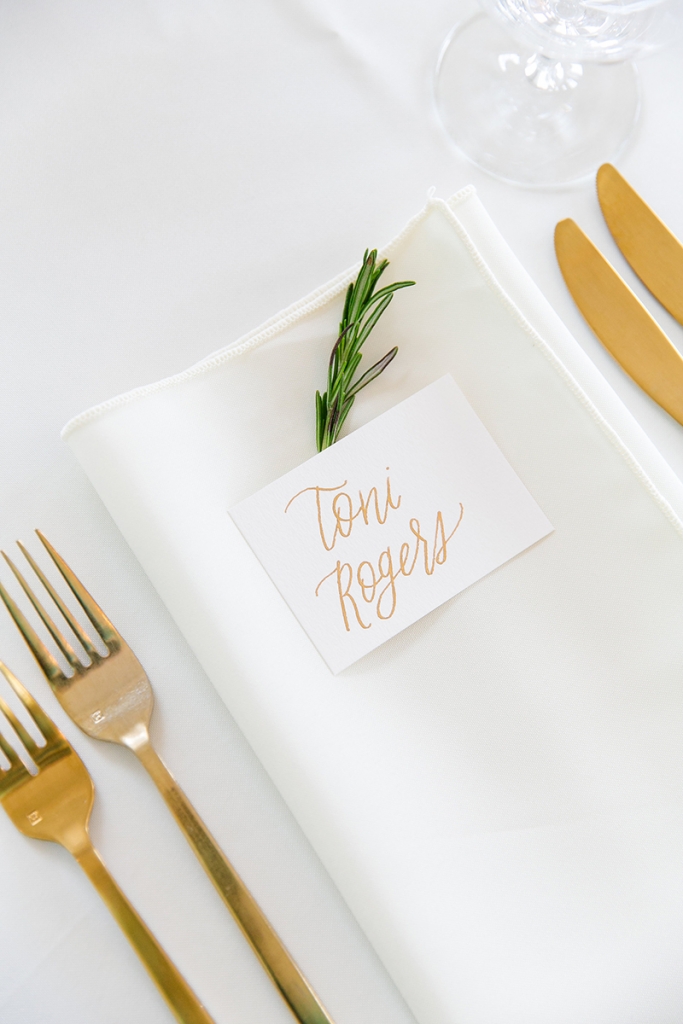 TIP: Stick with one calligrapher. Gold calligraphy (seen here on the invitations and place cards) is as ornate as it gets. Keep the look clean by using the same artist for multiple elements in the metallic hue.  Image by Dana Cubbage Weddings