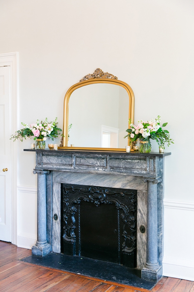 TIP: Work with your venue’s existing décor. Indoor brass lanterns and chandeliers and antique gilded mirrors pop up throughout The Gadsden House. Hone in on the underlying metallic in your venue’s lighting, hardware, and décor to coordinate your rentals and more.  Image by Dana Cubbage Weddings