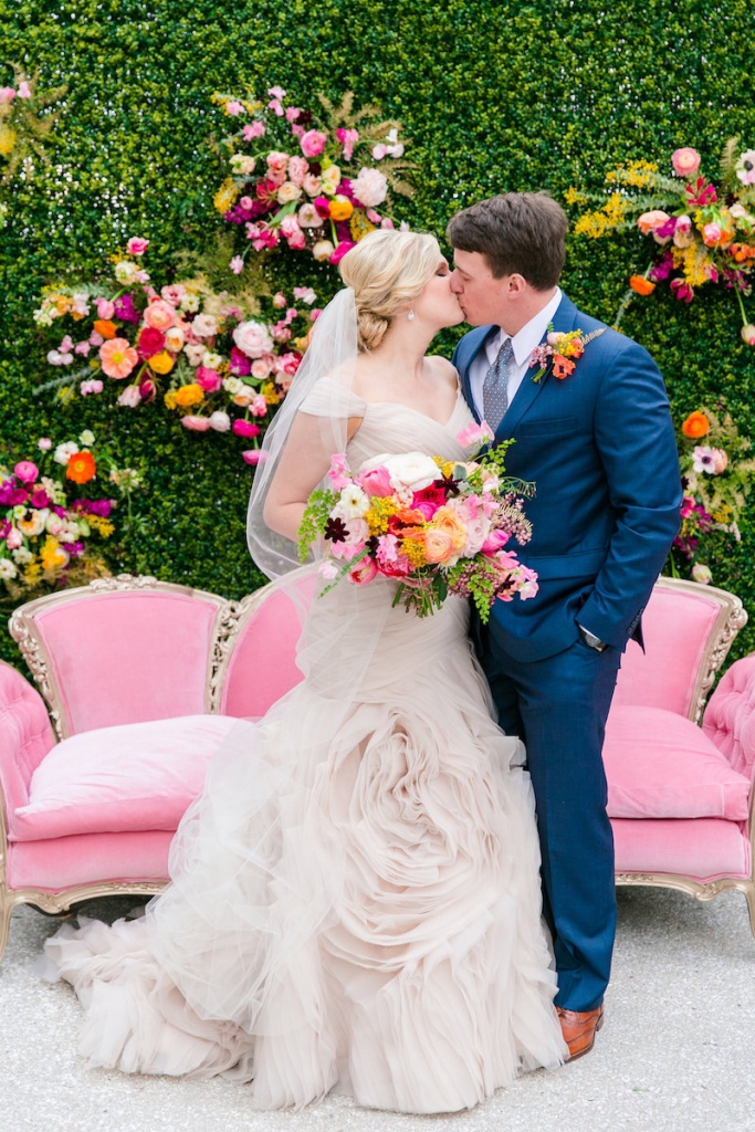 Florals by Branch Design Studio. Bride&#039;s gown by Essense of Australia from Gown Boutique of Charleston. Hair and makeup by Lashes and Lace. Groom&#039;s attire from Jos. A. Bank. Couch from 428 Main Vintage Rentals. Photograph by Dana Cubbage Weddings.