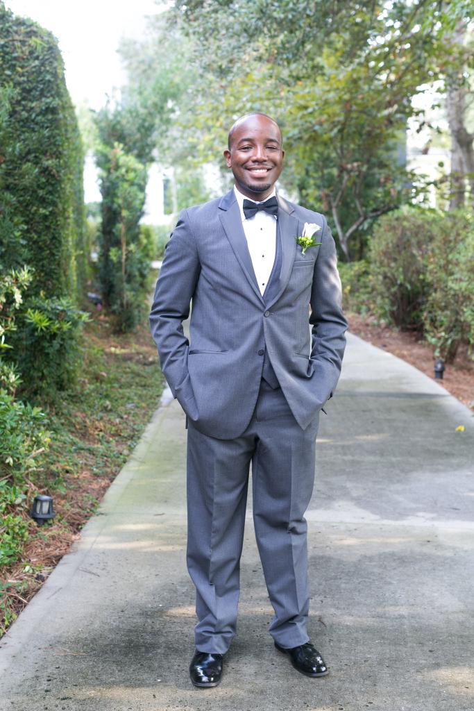 Groom’s attire from Charleston Tuxedo. Boutonniere by OK Florist. Photograph by Dana Cubbage Weddings at the Daniel Island Club.