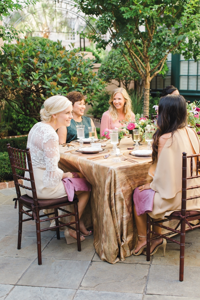 Smaller gatherings make using formal china more feasible. “You’d be surprised who may have a fabulous collection and wants to share—like your future mother-in-law,” says Calder. “Most of us agree—we don’t break it out enough!” WHAT THEY WORE: “MOG” Linda (second from left) in  BCBGMAXAZRIA’s “Sheridan” dress in  elm from Belk. Molly (third from left) in Alice + Olivia’s “Tammin” kaftan in dusty rose from Gwynn’s of Mount Pleasant; Sara Simpson Design tassel earrings from Bridal House of Charleston. &lt;i&gt;Photograph by Gayle Brooker&lt;/i&gt;