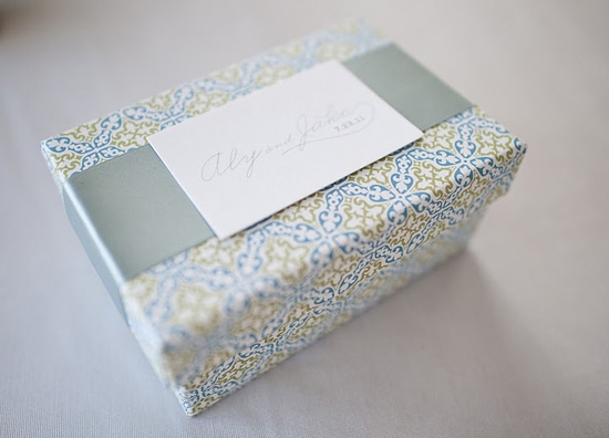 BELLA BOX: Treat-filled welcome boxes in the weddings colors and tied with a double-faced satin ribbon greeted guests.