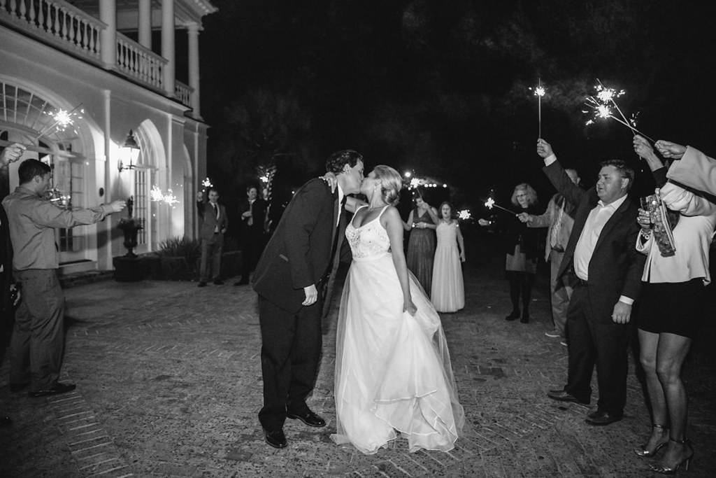 Bride&#039;s gown from Gown Boutique of Charleston. Photograph by Dana Cubbage Weddings at Lowndes Grove Plantation.