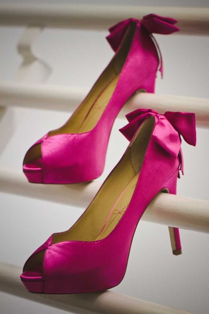 IF THE SHOE FITS: Marissa’s satin Pour La Victoire pumps complemented the day’s palette of gold, black and fuchsia (the bride’s favorite color).