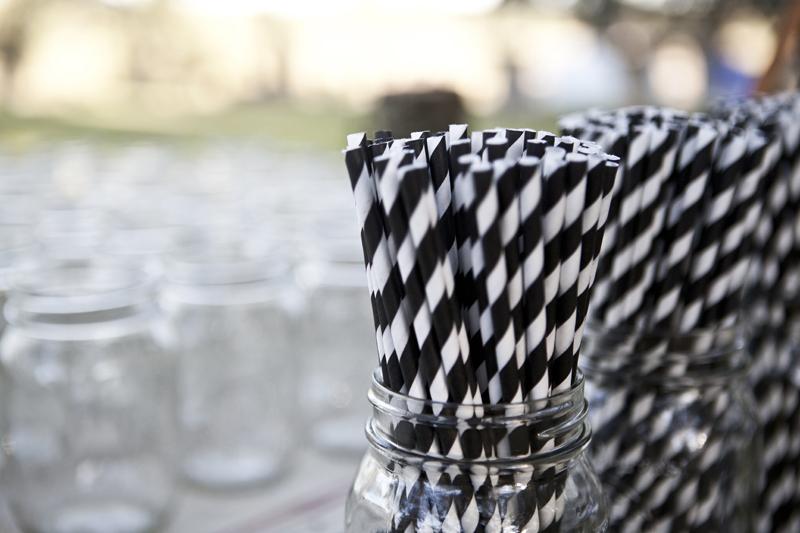 TAKE A SPIN: The black and white theme made its way to the bar setup by way of these grayscale candy cane striped straws.