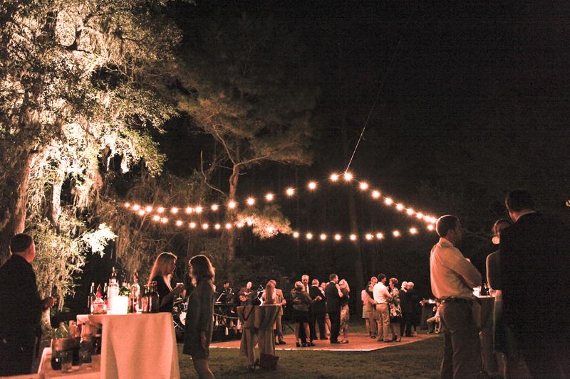 THE WORLD’S A STAGE: Ashley says of the reception: “John set up an amazing system in the trees over the stage and dance floor to suspend the string lights perfectly over the dance floor, just as I had envisioned.”