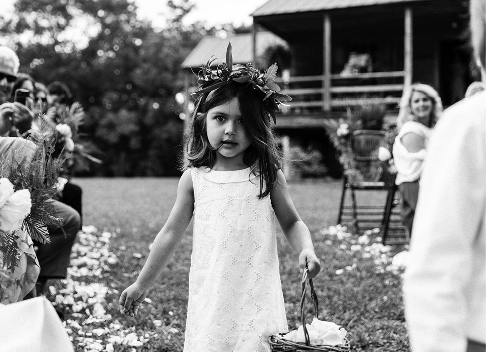 Flower girl Olivia (the mother-of-the-bride’s cousin’s daughter) wore a miniature version of the bridesmaids’ leafy crowns.  &lt;i&gt;Photograph by Olivia Rae James&lt;/i&gt;